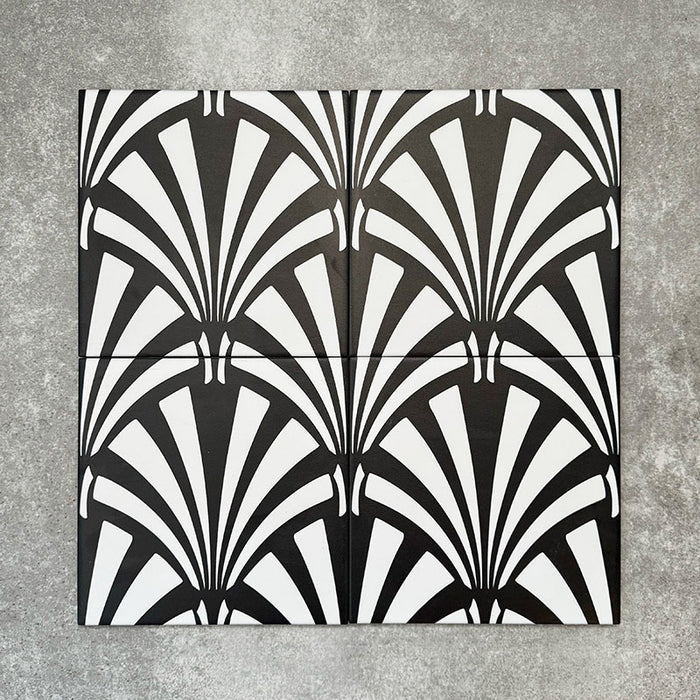 Four Almeria Casablanca Moroccan-style porcelain wall and floor tiles displayed together in a bold black and white fan pattern, 20x20cm.