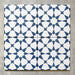 Agadir Navy Blue Moroccan-style 20x20cm porcelain tiles arranged as four tiles, showcasing a repeating geometric star pattern in navy and white on a neutral background.