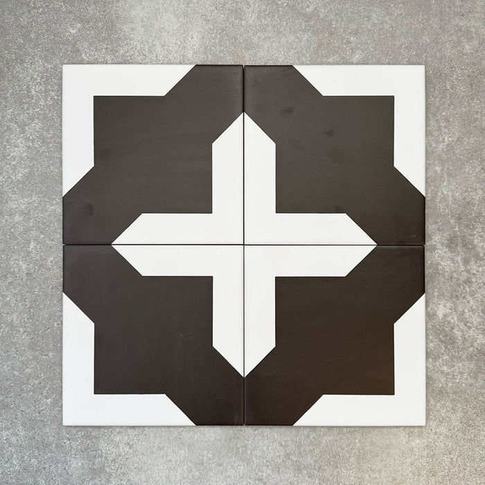 Four Almeria Cathedral Moroccan-style porcelain wall and floor tiles displayed together in a bold black and white geometric pattern, 20x20cm.