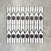 Four Almeria Felis Moroccan-style porcelain wall and floor tiles displayed together in a bold black and white geometric dot and line pattern, 20x20cm.