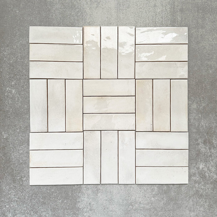 Saigon White Brick Wall tiles arranged in a basketweave pattern, featuring Moroccan-style 5.1 × 16.1cm glossy ceramic tiles in soft white tones with subtle tonal variation.