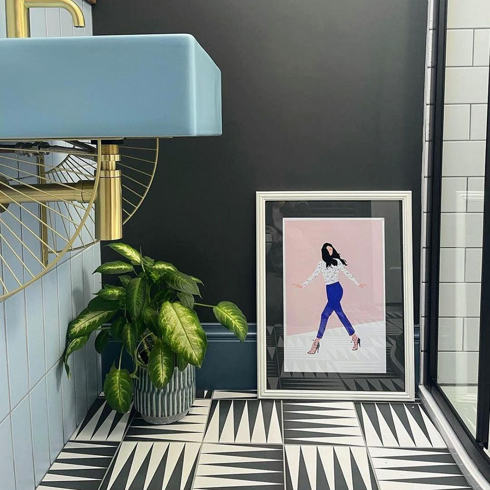 Bathroom featuring Almeria Backgammon Moroccan-style porcelain wall and floor tiles in a bold black and white geometric pattern, 20x20cm, styled with a modern basin and dark painted walls.