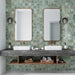 Bathroom featuring Saigon Celadon Green Decor Square Wall tiles in a Moroccan-inspired style, 10 × 10cm glossy ceramic tiles in soft green and blue tones with a decorative relief pattern, paired with a double vanity and wall-mounted mirrors.