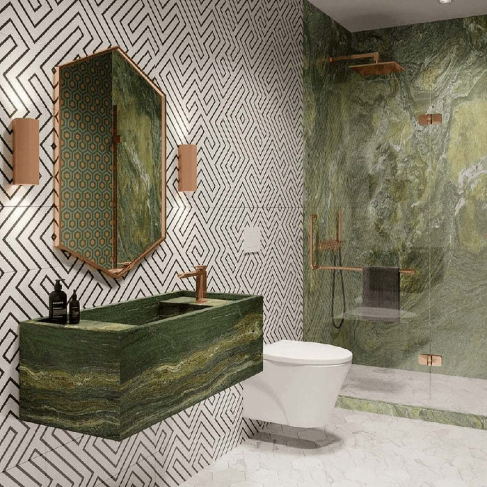 Bathroom featuring Almeria Jilani White Moroccan-style wall and floor tiles in a geometric maze pattern, 20x20cm, paired with green stone finishes and brass accents.
