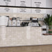 Commercial café counter clad in Saigon White Square Wall tiles in a Moroccan-inspired style, featuring 10 × 10cm glossy ceramic tiles in soft white tones with subtle tonal variation.