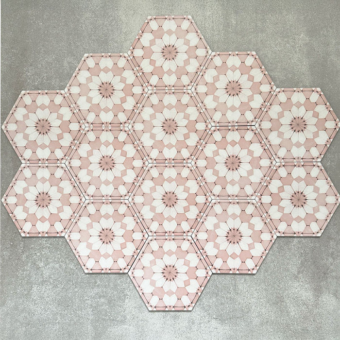 Grouped layout of Medina Dusty Pink Moroccan-style hexagon porcelain tiles, 18.7 × 21.6 cm, displaying the full repeating geometric pattern in soft dusty pink and white tones on a neutral background.