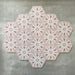 Grouped layout of Medina Hormuz Rose Moroccan-style hexagon porcelain tiles, 18.7 × 21.6 cm, showcasing the full repeating star-inspired geometric pattern in soft rose and white tones on a neutral background.