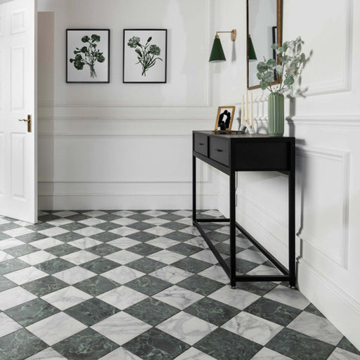 Hallway floor featuring Vitoria Classic green marble-style porcelain chequerboard tiles in a 30 × 30cm format, combining rich green and soft white marble-effect squares laid diagonally, paired with traditional panelling, black console furniture, and botanical décor for a timeless, elegant entrance.