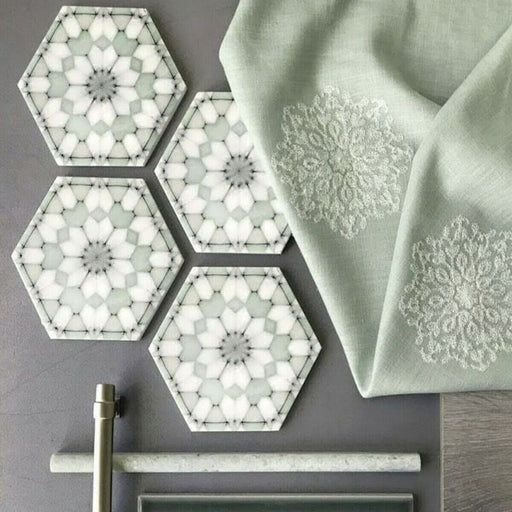 Bathroom detail featuring Medina Soft Green Moroccan-style hexagon porcelain tiles, 18.7 × 21.6 cm, with a soft geometric pattern in muted green and white tones, styled with brass fittings and neutral accessories.