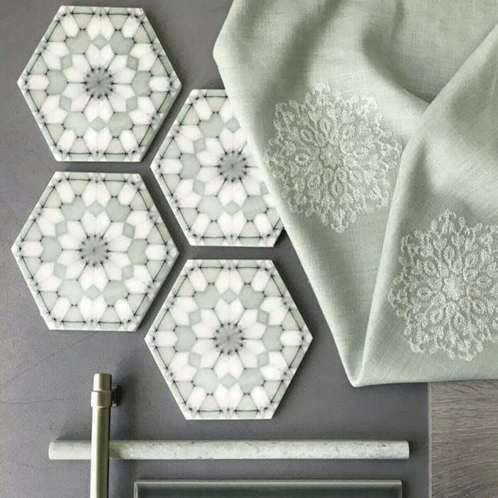 Bathroom detail featuring Medina Soft Green Moroccan-style hexagon porcelain tiles, 18.7 × 21.6 cm, with a soft geometric pattern in muted green and white tones, styled with brass fittings and neutral accessories.