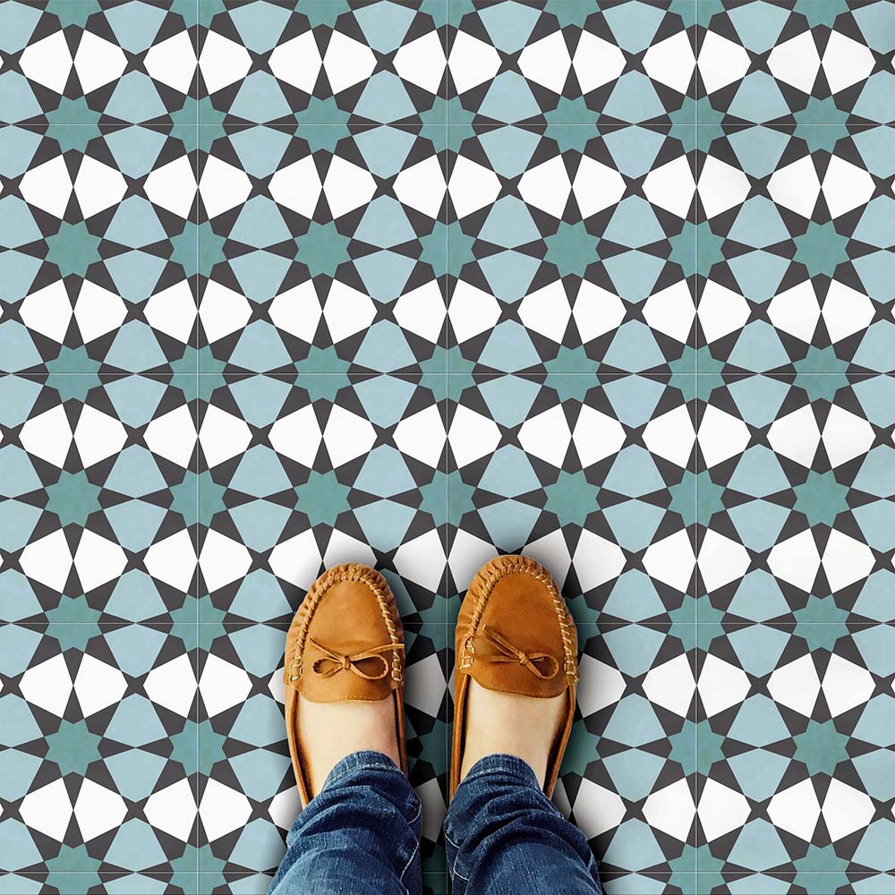 Marketing image featuring Agadir Verde Moroccan-style 20x20cm porcelain floor tiles laid in a repeating geometric star pattern in green, white and charcoal tones, styled with shoes to highlight scale, durability and everyday use.