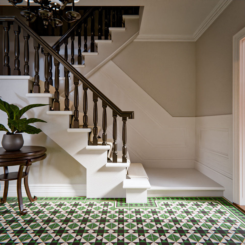 Hallway featuring Greenbrook Manor anti-slip encaustic Victorian-style porcelain floor tiles, 20 × 20 cm, laid in a bold geometric pattern with green, black and white tones beneath a traditional staircase.