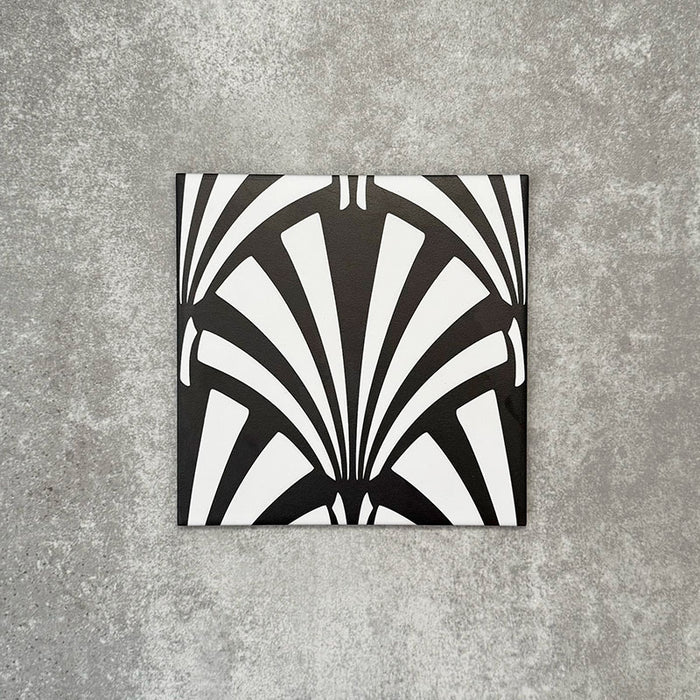 Single Almeria Casablanca Moroccan-style porcelain tile featuring a bold black and white fan pattern, 20x20cm, suitable for wall and floor use.