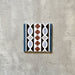Single Imperial Victorian Blue Mini Border Tile, 15x15cm porcelain tile featuring a classic Victorian-inspired border pattern in blue, black, white, and terracotta tones, photographed on a neutral background.