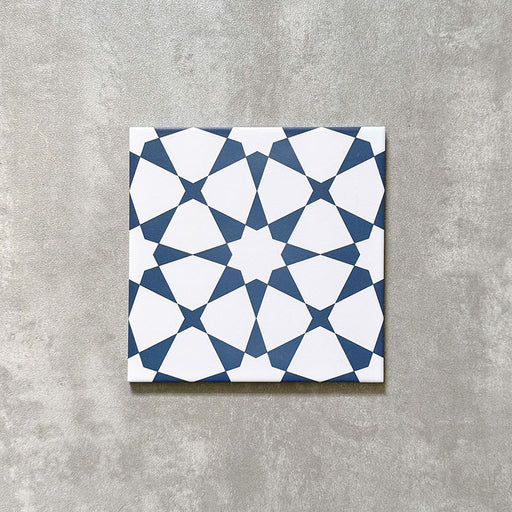 Agadir Navy Blue Moroccan-style 20x20cm porcelain tile featuring a geometric star pattern in navy and white, shown as a single tile on a neutral background.