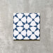 Agadir Navy Blue Moroccan-style 20x20cm porcelain tile featuring a geometric star pattern in navy and white, shown as a single tile on a neutral background.