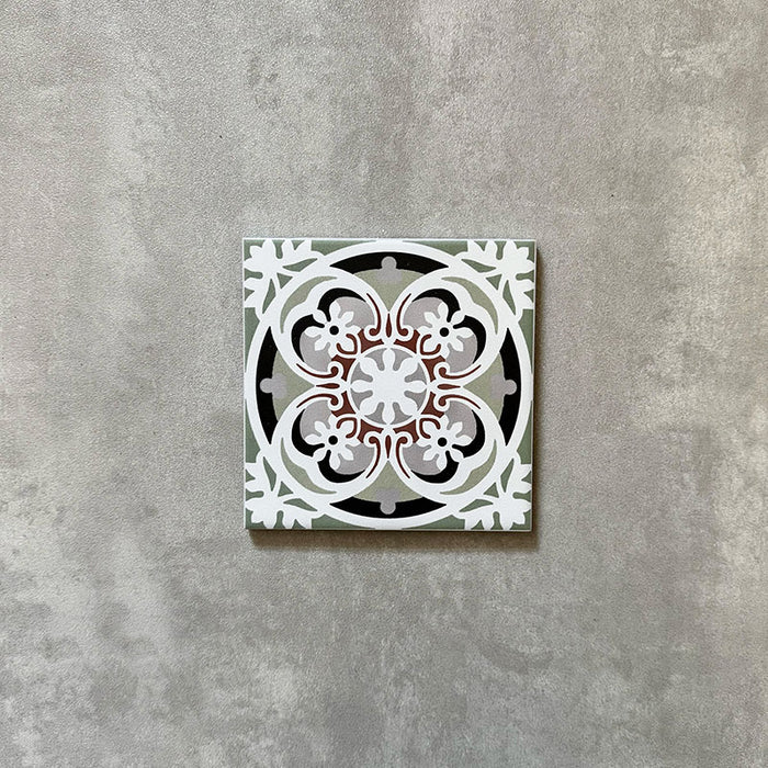 Single Imperial Victorian Green Mini Tile, 15x15cm porcelain tile featuring a classic Victorian-inspired pattern in soft green, grey, white, and terracotta tones, photographed on a neutral background.