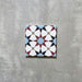 Agadir Atlas Mini Moroccan-style 15x15cm porcelain tile featuring a geometric star pattern in soft blue, burgundy, black and cream, shown as a single tile on a neutral background.