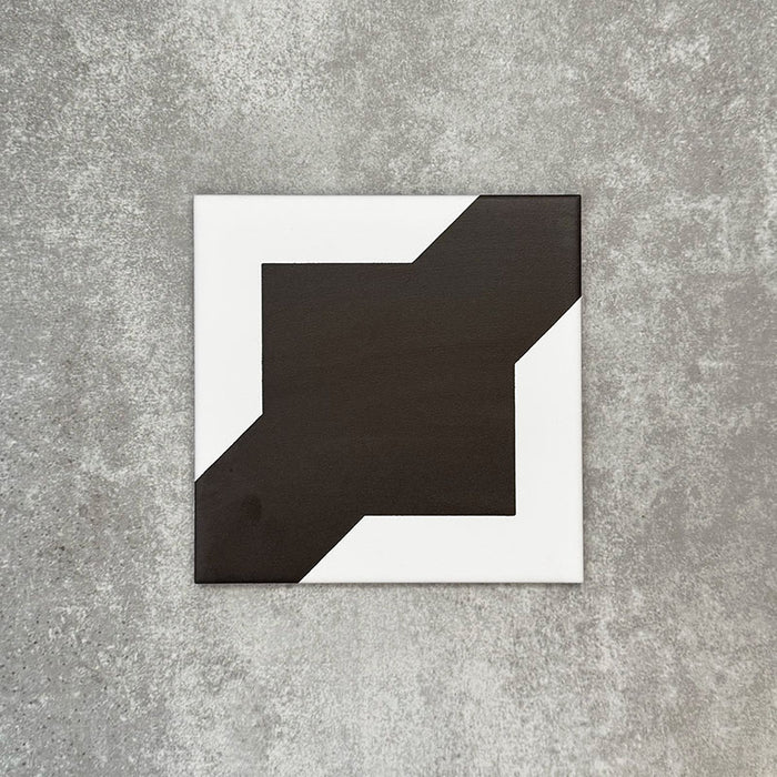Single Almeria Cathedral Moroccan-style porcelain tile in a bold black and white geometric design, 20x20cm, suitable for wall and floor use.