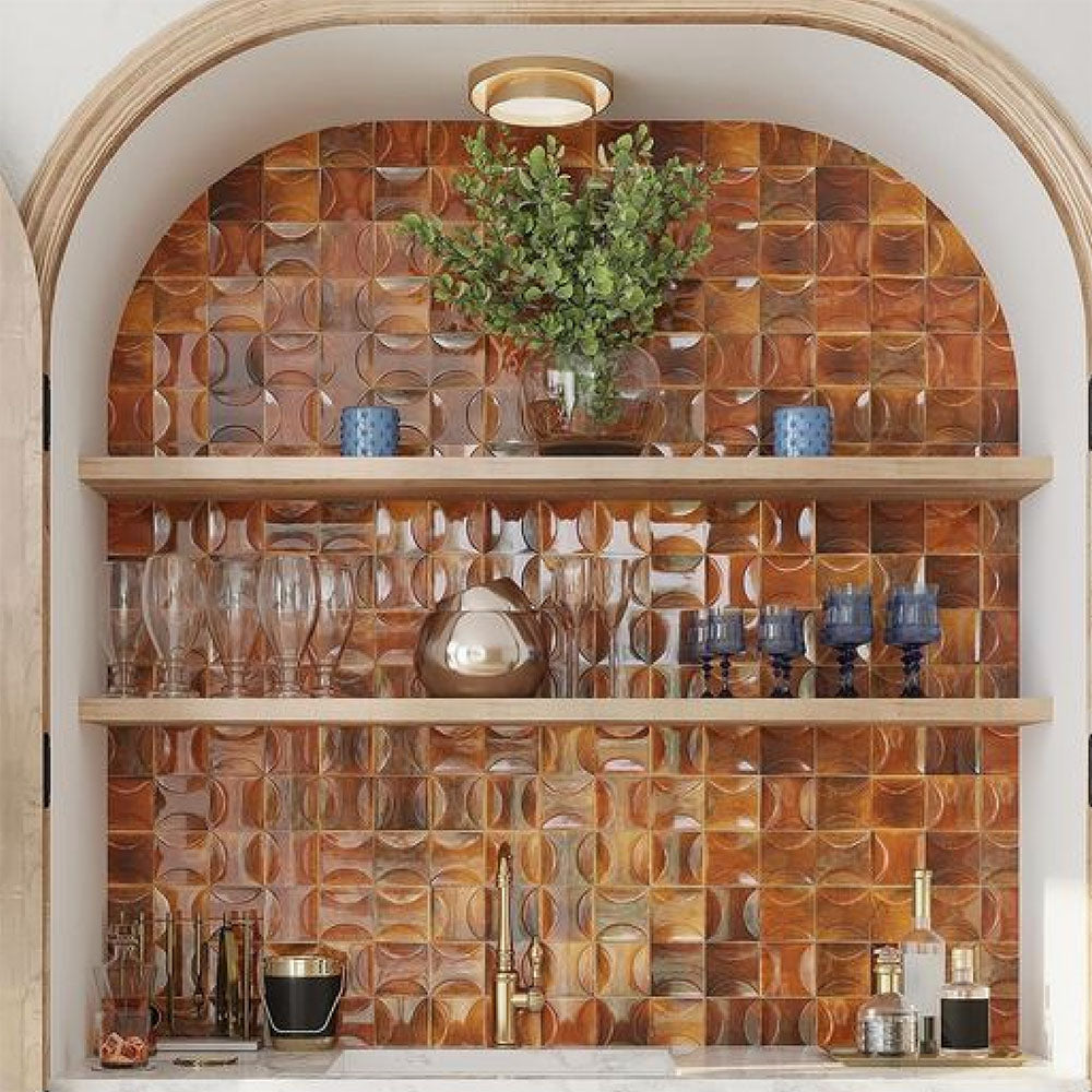 Feature wall with arched shelving clad in Saigon Amber Decor Square Wall tiles, showcasing Moroccan-style 10 × 10cm glossy ceramic tiles in warm amber tones with a decorative surface pattern.