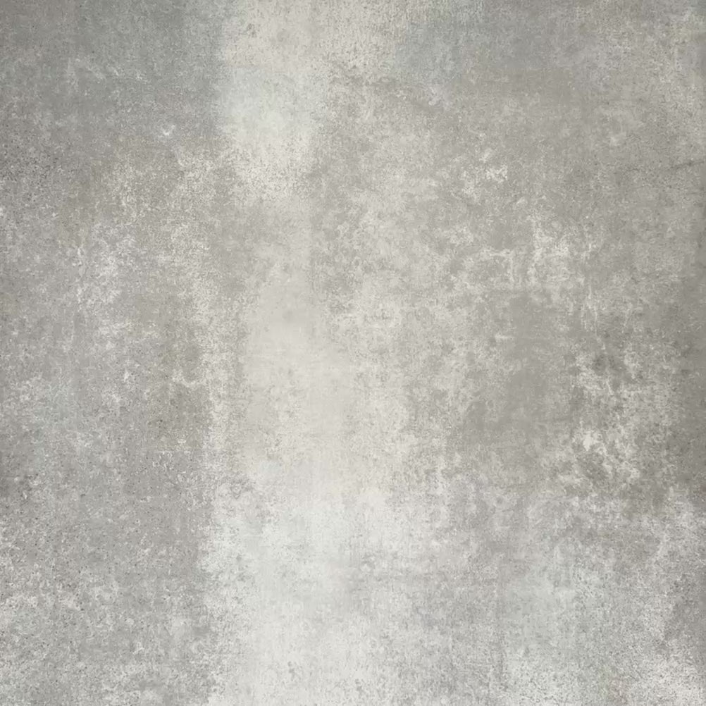 Video showcasing Zellige Pink Mist Square 13.2 × 13.2cm Moroccan-style ceramic tiles in soft pale pink and blush tones, arranged in a simple grid on a textured grey background, showcasing the glossy glaze, subtle tonal variation and handcrafted zellige-effect finish.