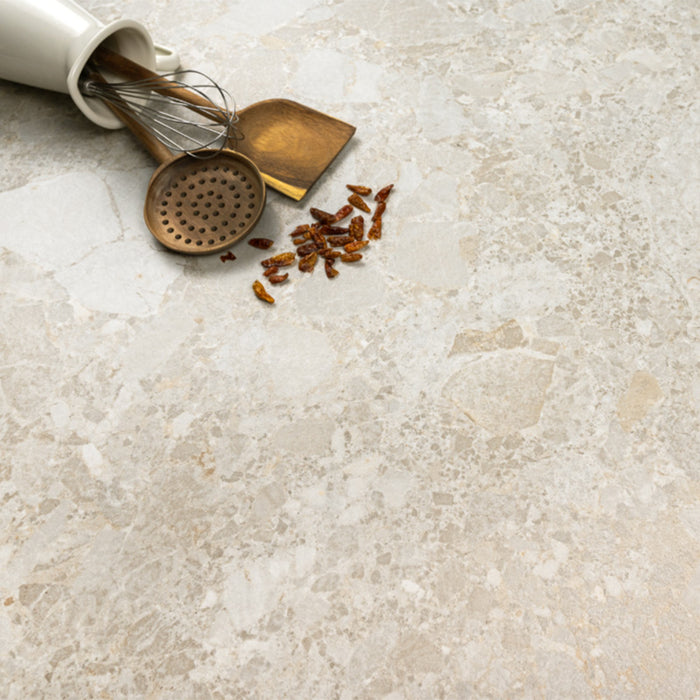Essentials Terrazzo Stone Avorio 60x120 porcelain tile surface, fine terrazzo-style stone fragments with subtle tonal variation