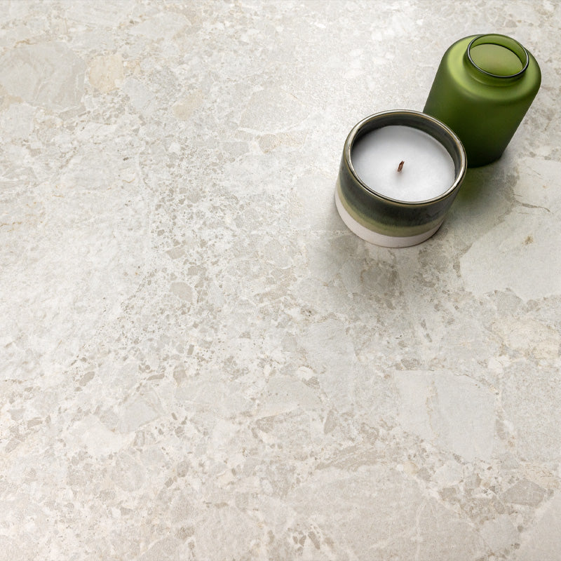 Essentials Terrazzo Stone Blanca 60x120 porcelain tile surface, fine terrazzo-style stone fragments with subtle tonal variation