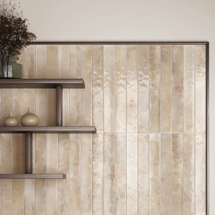 Jumairah Almond Nut Gloss tiles installed vertically as a kitchen splashback, showcasing soft beige tones and a reflective handmade-style finish.